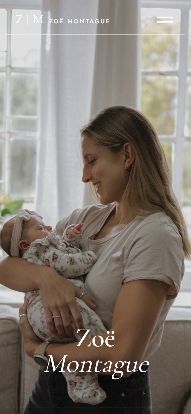 The Zoë Montague Photography home page on a phone: the mother and her newborn by the window, in portrait
